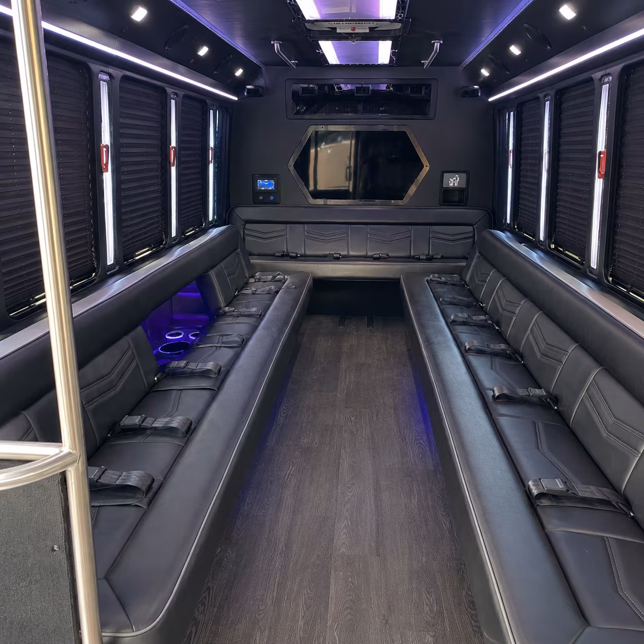 Friends laughing during a party bus celebration in Wichita